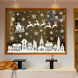 White Christmas window decals featuring Santa's sleigh and European city skyline silhouette