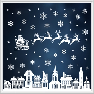 Detail of white Christmas window stickers featuring reindeer sleigh and snowy house silhouettes
