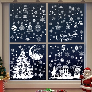 Detail view of white Christmas window stickers with Russian Happy New Year text and snowflakes