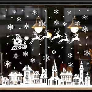 White Christmas window decals featuring Santa's sleigh and snowy village silhouettes