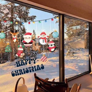 Bunte Weihnachts-Fensteraufkleber Set mit Weihnachtsmann und Elch auf Glasscheibe