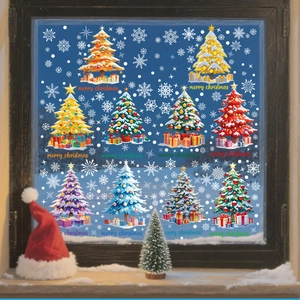 Detailed view of colorful Christmas tree static stickers and snowflakes on a glass window