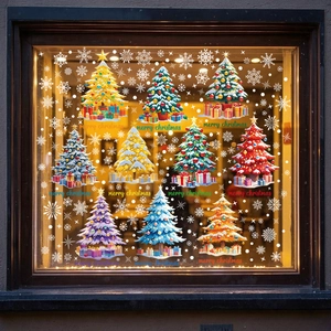 Detailed view of colorful Christmas tree window clings with gift boxes on glass pane
