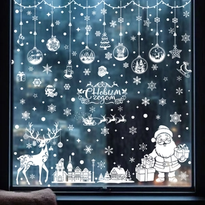 White Christmas window decals featuring Santa, reindeer and snowflakes on glass