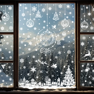 Close-up of white festive static window decals with snowflakes and Russian text on glass