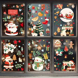 Close-up of festive Christmas window stickers with Santa Claus and snowflakes on glass