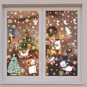 Watercolor Christmas window decals featuring reindeer, snowman, and forest animals on glass