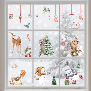 Close-up of watercolor forest animals and snowflake static window clings on glass