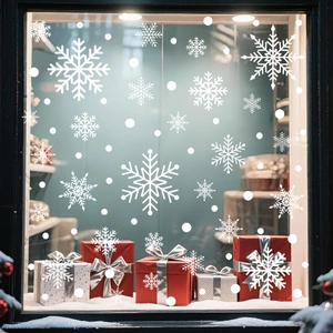 White snowflake window decals with festive red and white gift boxes for Christmas decor