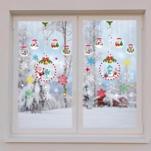 Detail of Santa and reindeer electrostatic glass stickers on a snowy window display