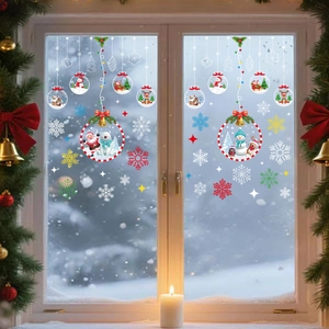 Festive Christmas window decals featuring Santa, reindeer and snowflakes on glass