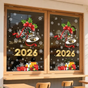 Detail of 2026 Christmas bells and snowflakes window decals on a glass storefront