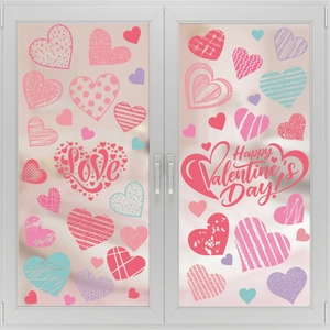 Detailed view of colorful heart static window clings for Valentine's Day decor on white glass