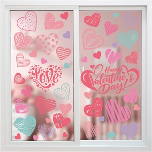 Detail of pink and red heart window clings with stripes and dots for Valentine decoration