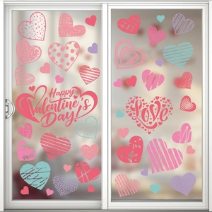 Detail of artistic heart-shaped window stickers with patterns on a glass door