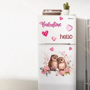 Close-up of owl and heart stickers on a white fridge for Valentine's Day decor