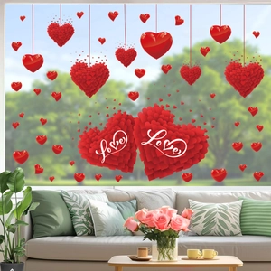 Detail of red heart window stickers with Love text on glass for romantic home decor