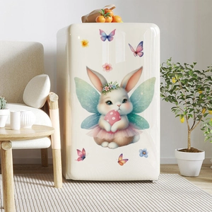 Detailed view of Easter bunny angel static sticker on a cream refrigerator surface