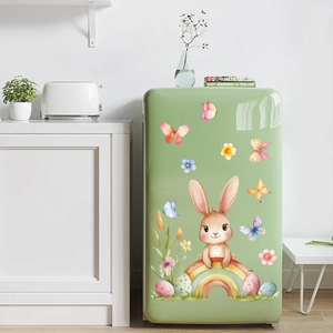 Easter bunny and rainbow wall stickers displayed on a green refrigerator in a kitchen