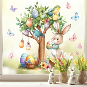 Oster-Fensterbilder mit Aquarell-Hase, buntem Eierbaum und Blumen auf einer Glasscheibe