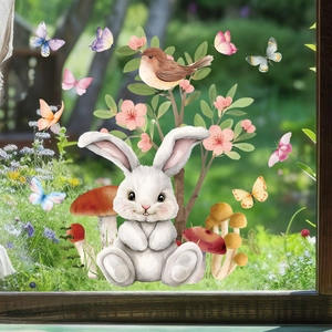 Dettaglio di adesivi pasquali con coniglio ad acquerello, albero in fiore e farfalle colorate