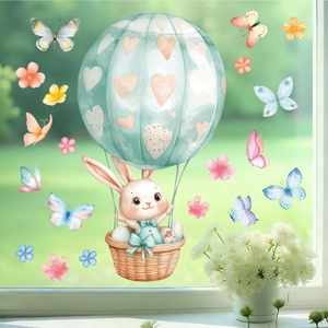 Détail des stickers lapin de Pâques aquarelle sur vitre avec décorations florales