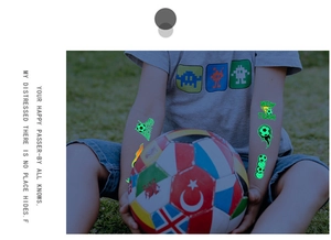 Luminous football temporary tattoos on child's arm with glowing soccer ball and flames