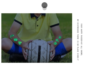 Glow-in-the-dark football temporary tattoo for kids with green luminous goal effect