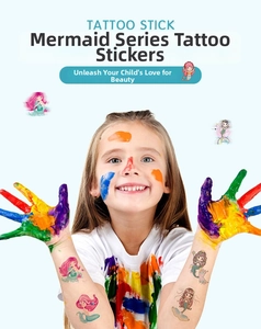 Detailed view of colorful mermaid temporary tattoos on a child's arm for party fun