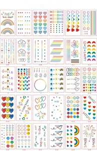 Detail view of 30-piece set colorful rainbow temporary tattoos with hearts and smiles
