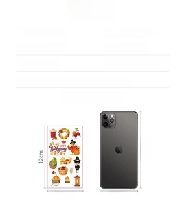 Size comparison of waterproof Thanksgiving temporary tattoos featuring turkey and pumpkins
