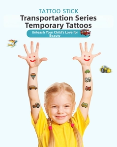 Girl showing colorful cartoon vehicle temporary tattoos including bus and helicopter