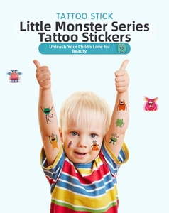 Waterproof cartoon monster temporary tattoo stickers shown on a smiling child's arm and face