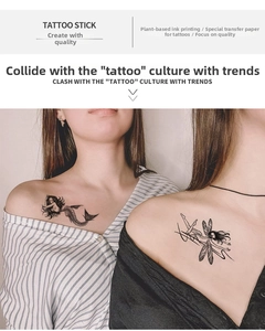 Detail of waterproof temporary mermaid and fairy tattoos on shoulder and collarbone