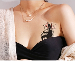 Detail of waterproof temporary tattoo with fox mask and girl design on collarbone