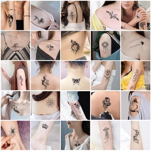 Set of 25 black and white temporary tattoos featuring animal, floral and artistic designs