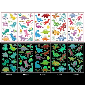 Luminous cartoon dinosaur temporary tattoos showing glowing effect in darkness