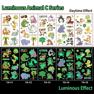Luminous cartoon animal temporary tattoos showing day colors and green night glow effect