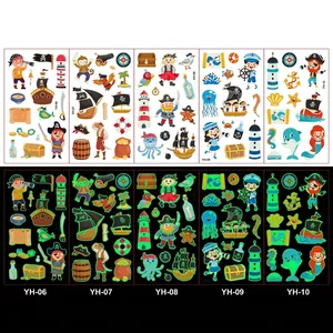 Luminous pirate theme temporary tattoos for kids showing day colors and green glow at night