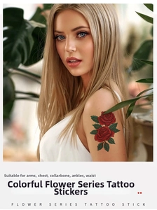 Close-up of vibrant red rose tattoo stickers on arm with flower series text