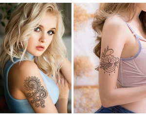 Detailed view of black mandala and floral temporary tattoo stickers on woman arm