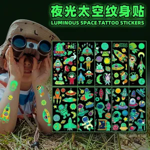 Luminous space tattoos set for kids featuring glow in the dark rockets and astronauts