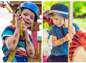 Detailed view of colorful circus temporary tattoos applied on a smiling boy at an amusement park