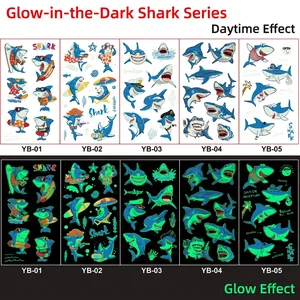 Luminous cartoon shark tattoo stickers for kids showing day colors and green night glow