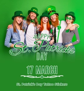 Group of happy people wearing green St. Patrick's Day temporary tattoos and party accessories