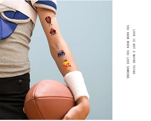 Temporary American football tattoos applied on a child's arm for party decoration