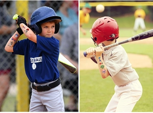 Close-up of kids wearing baseball themed temporary tattoos on arms at a ballgame