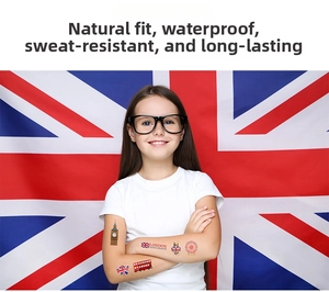 Detail of London themed temporary tattoos with Big Ben and flag on a girl's arm