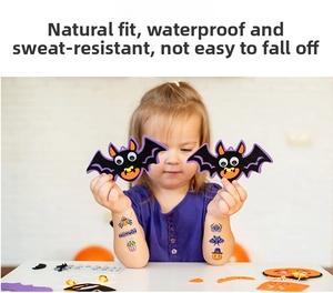 Close-up of waterproof Halloween temporary tattoos and purple bat felt charms for kids