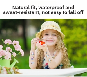 Girl showing colorful unicorn glitter tattoos on arm with waterproof design